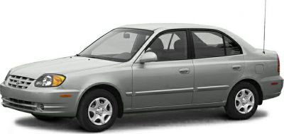 Silver four-door sedan showing front side profile and smooth design.