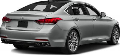 Rear view of silver luxury sedan with quad exhaust and sleek tail lights