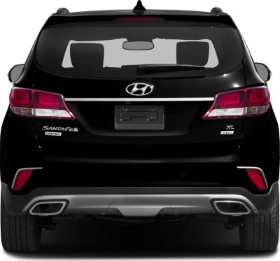 Rear view with taillights, dual exhaust outlets, and AWD badge