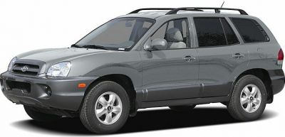 Silver mid-2000s SUV side front view with alloy wheels and roof rails