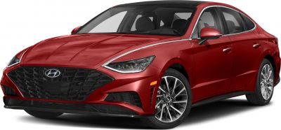 Front grille, headlights, and alloy wheels of a red sedan