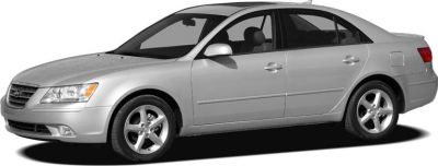 Silver sedan with alloy wheels and four-door profile