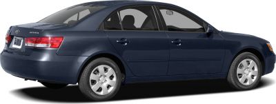 Side rear view of mid-2000s sedan with alloy wheels and distinct taillights