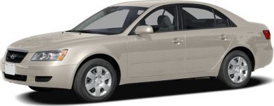 Beige mid-size sedan with smooth contours and four doors.