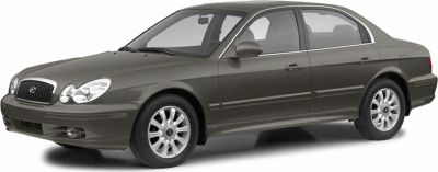 Mid-size sedan with dual headlights and a sleek front grille design
