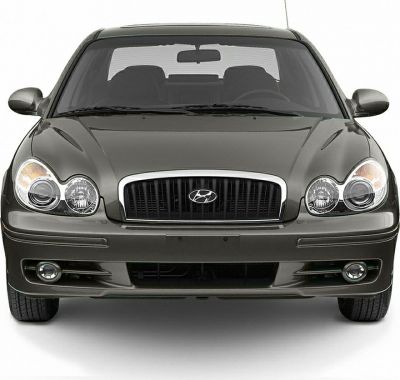 Dual headlights and grille with fog lights on front of sedan