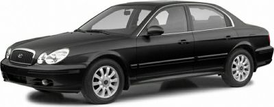 Front side view of black sedan with alloy wheels