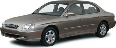 Front side view of mid-size sedan with rounded headlights and alloy wheels