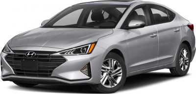 Silver sedan with sharp headlights and bold front grille.