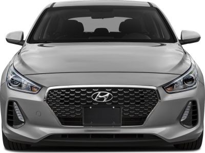 Front view showing hexagonal grille and sleek headlights.