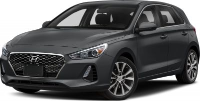 Front-side view with hexagonal grille, headlights, and alloy wheels