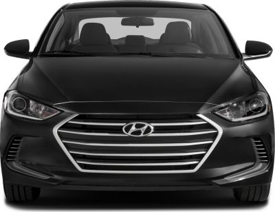 Front view with prominent grille and headlights
