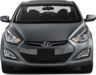 Close-up front view with headlights, grille, hood, and side mirrors