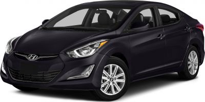 Front side view of compact sedan with sleek headlights and alloy wheels