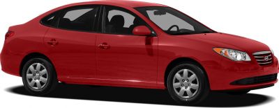Side view of a compact sedan with aerodynamic shape and alloy wheels