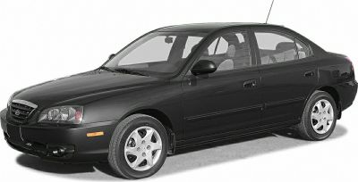 Black sedan with alloy wheels and distinctive front headlights