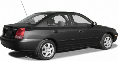 Black sedan with side and rear view showing smooth lines and rear taillights