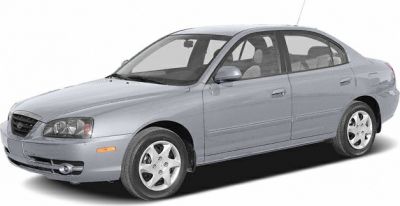 Silver sedan with four doors and alloy wheels, front side angle.