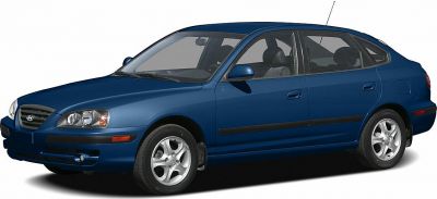 Blue compact hatchback with alloy wheels side profile
