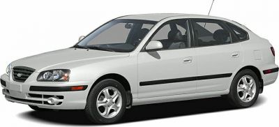Front side view of a five-door hatchback with alloy wheels and sleek headlights