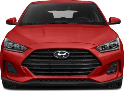 Front view showing hexagonal grille and sleek headlights of a red car