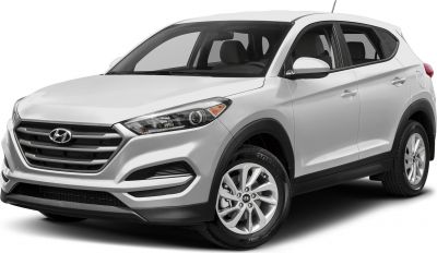 Front side view of SUV with distinctive headlights and grille