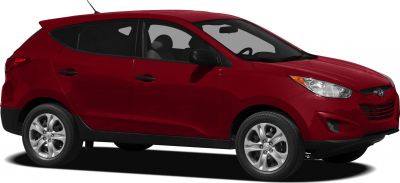 Side profile of red SUV with alloy wheels and sleek headlights