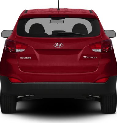 Red SUV rear with taillights, rear window, and badges