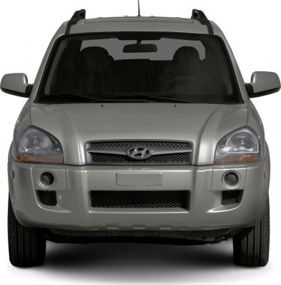 Front view with grille, headlights, and roof rails