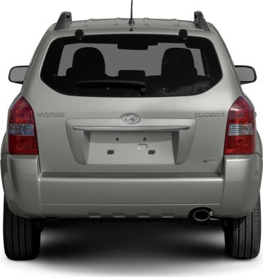 Rear view with taillights, rear window, bumper, and exhaust pipe.