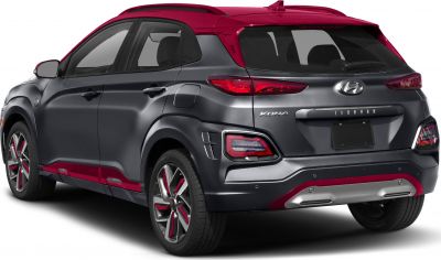 Rear side view with two-tone black and red paint, alloy wheels, and distinct taillights