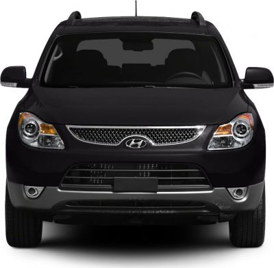Front view with grille, headlights, and side mirrors