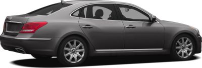Sleek luxury sedan rear side view with distinctive tail lights and alloy wheels