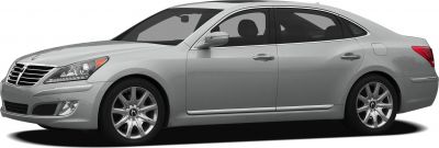 Silver luxury sedan with chrome grille and alloy wheels, front side profile