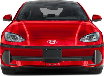 Front view of red electric sedan with LED headlights and aerodynamic design