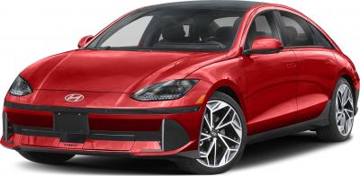Front view of red electric sedan with LED headlights and modern wheels