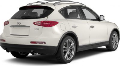 Rear side view with dual exhaust and alloy wheels