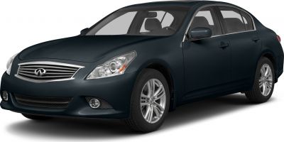 Front grille, headlight, and alloy wheel of a sedan.