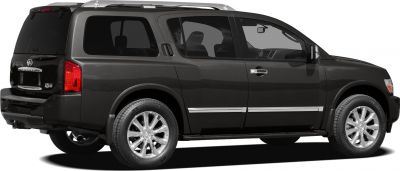 Rear side view of large SUV with chrome wheels and roof rails