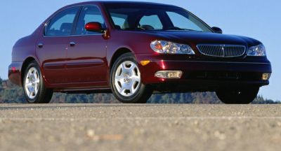 Front side view of a sedan with signature headlights and alloy wheels