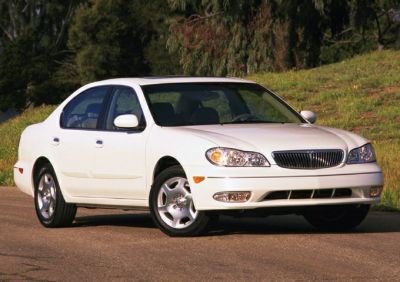 Front side view of sedan with distinctive grille and headlights