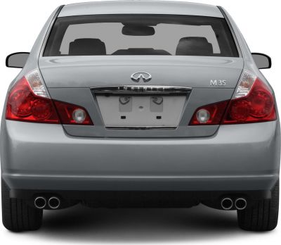 Rear of sedan with distinct taillights and quad exhaust
