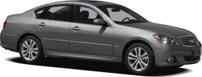 Luxury sedan side profile with alloy wheels and fog lights