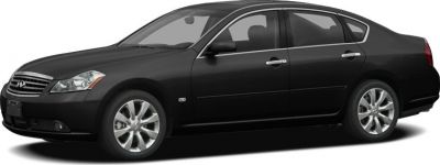Side view of sleek black sedan with alloy wheels and chrome handles
