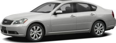 Silver sedan with alloy wheels and aerodynamic side profile.