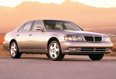 Front side view of a luxury sedan with alloy wheels and distinctive grille
