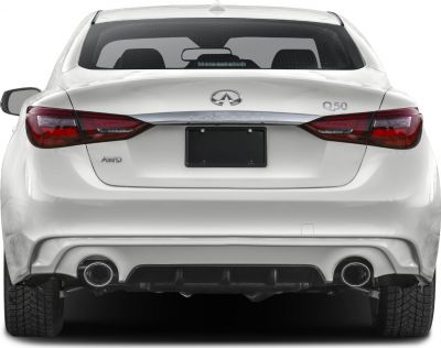 Rear view with LED taillights, dual exhaust, and AWD badge