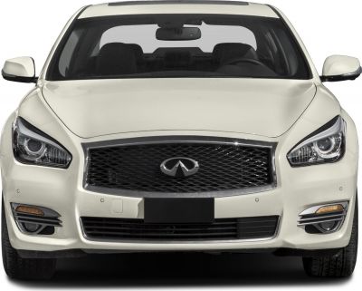 Close-up front view showing grille and headlights of luxury sedan