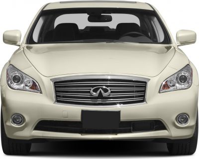 Front luxury sedan view with chrome grille and dual headlights