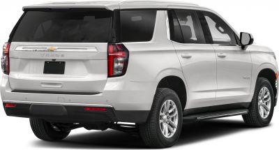 Rear side view of white SUV with tinted windows and modern tail lights
